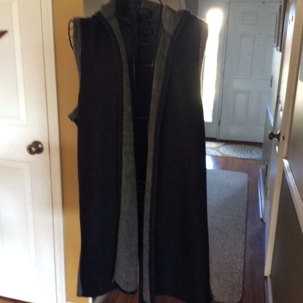 This lovely vest has a hood.